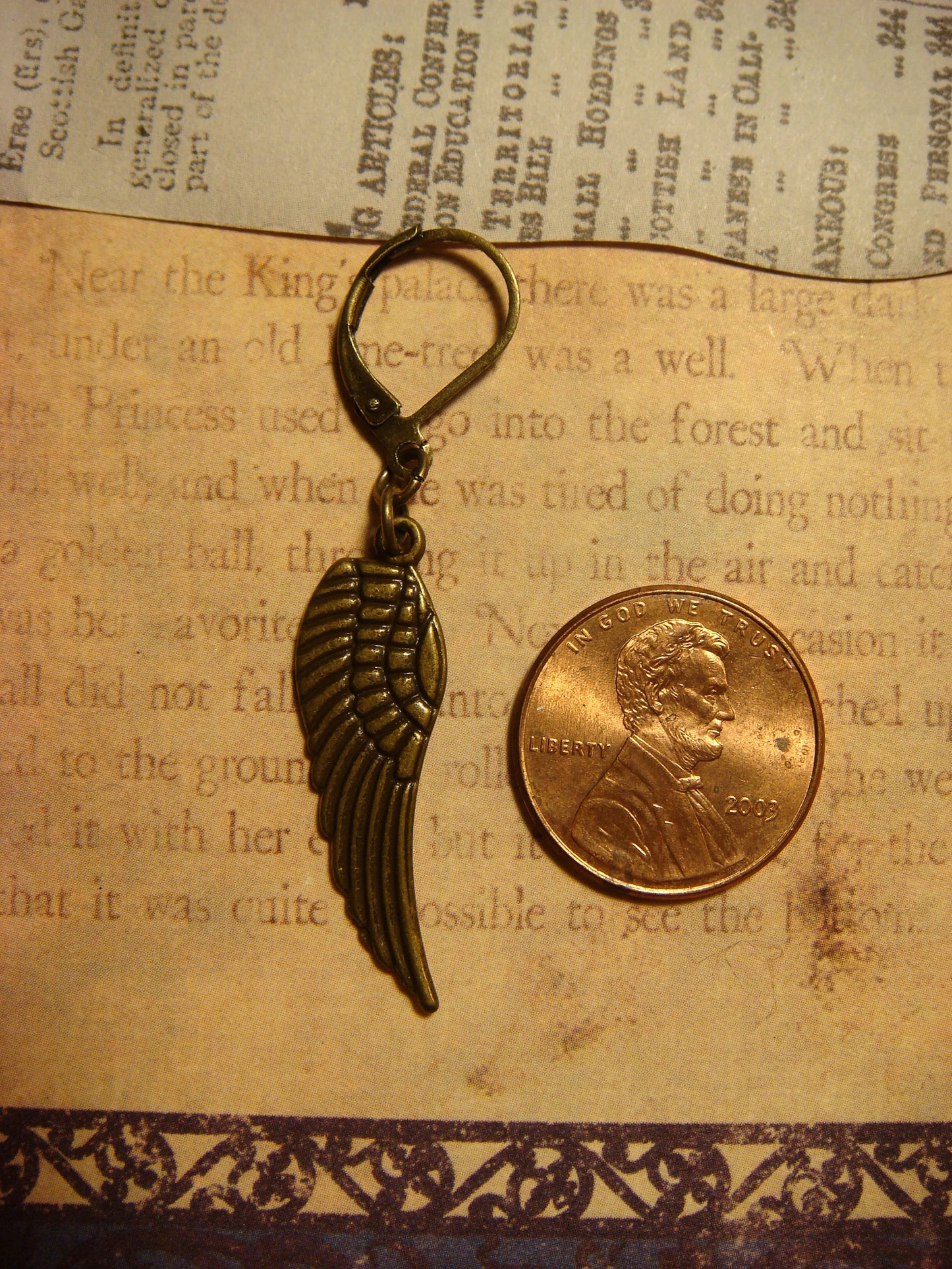 Wings Dangle Earrings in Antique Bronze
