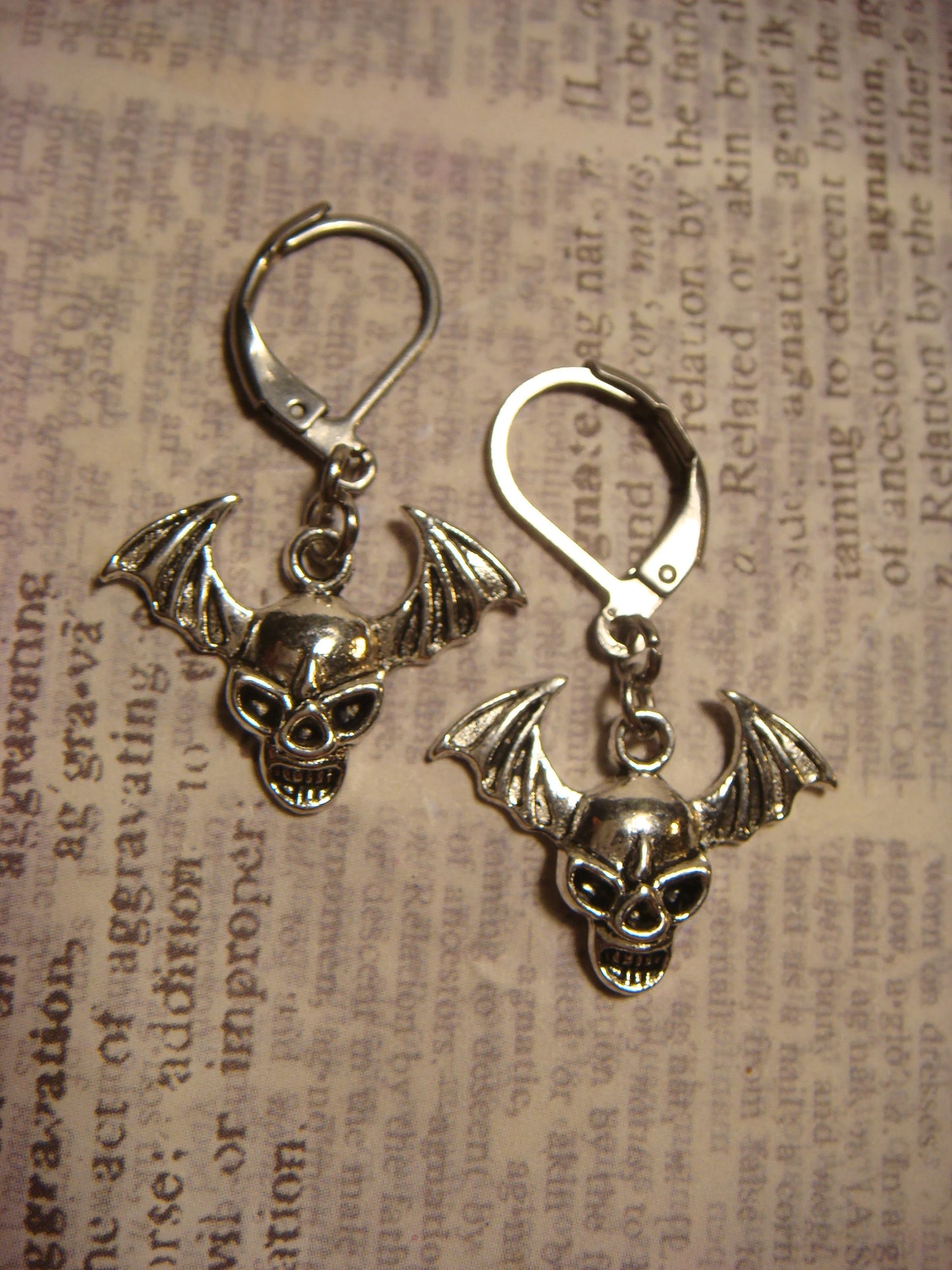 Flying Skull Dangle Earrings in Antique Silver