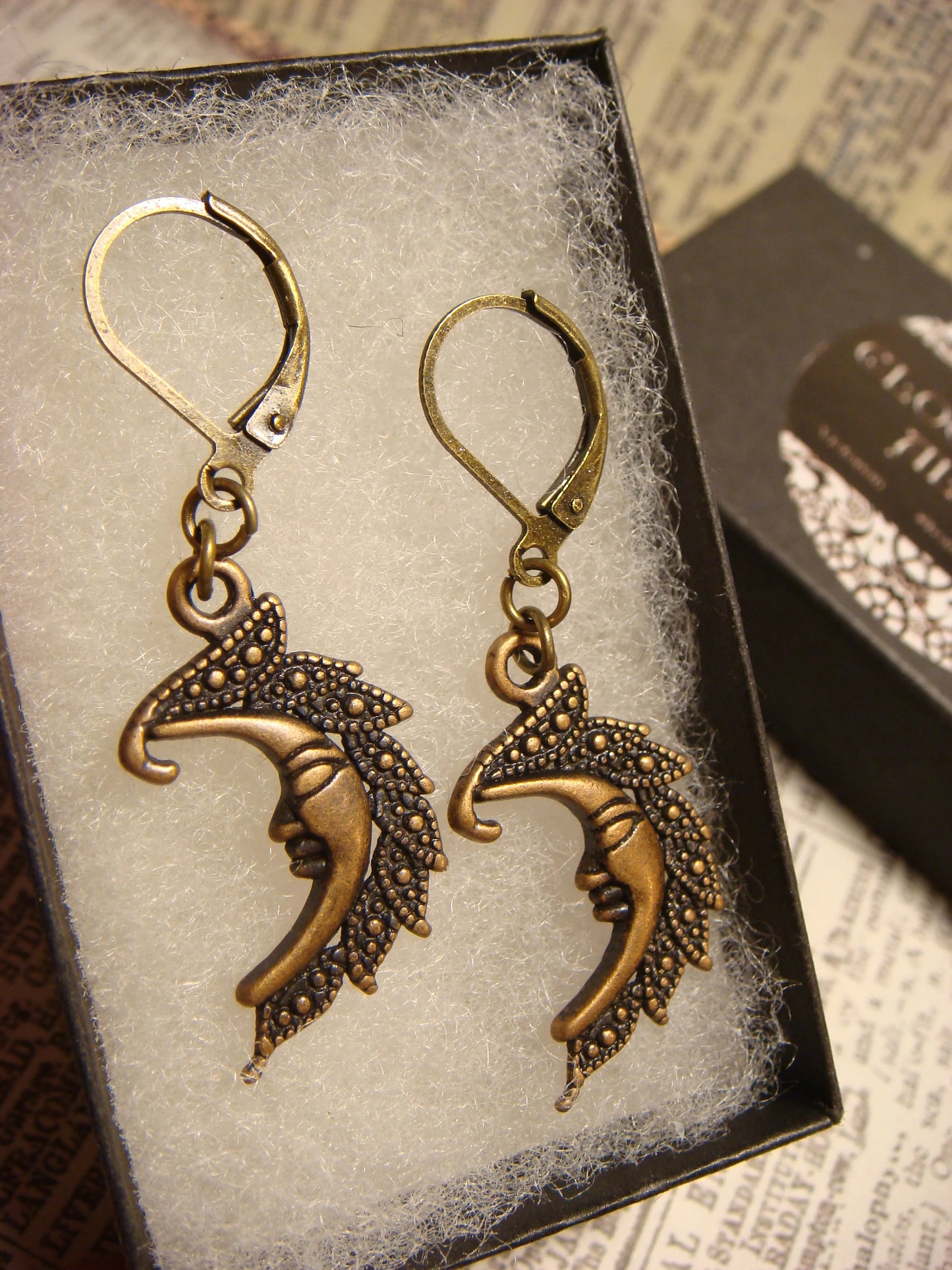 Moon Face Dangle Earrings in Antique Bronze