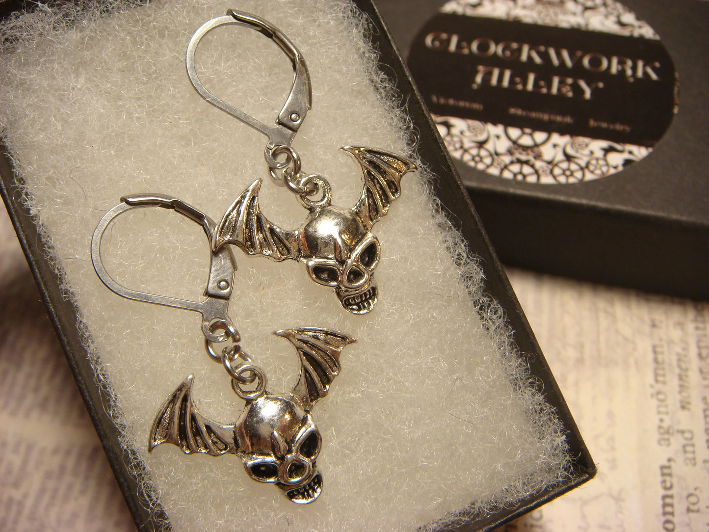 Flying Skull Dangle Earrings in Antique Silver