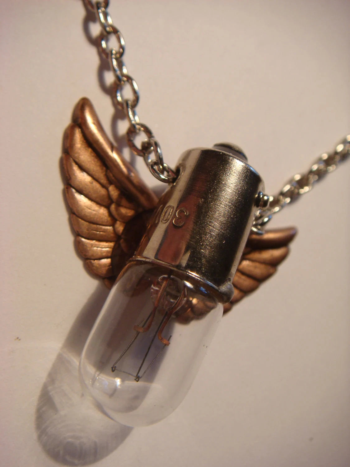 Light Bulb with Copper Wings Necklace